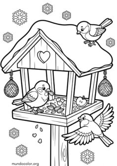 Invierno – Casita de pájaros cubierta de nieve con comida